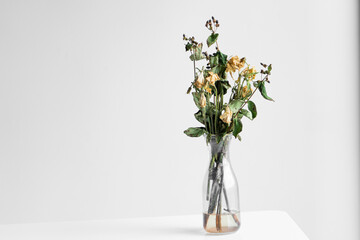Bouquet of wilted flowers on a white background