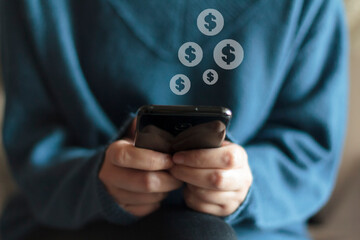 Woman holding smartphone with dollar icon