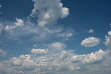 Picturesque snow-white cumulus clouds in the sky.