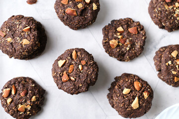 Vegan Almond oatmeal chocolate cookies set in cafe table.