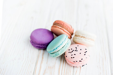 Tasty bright colored macaroon isolated on a white background. Sweet and colorful French macaroons. Dessert. Homemade sweets. Café dessert. Selective focus