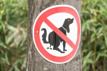 Dogs not allowed to poop. No dog poop sign