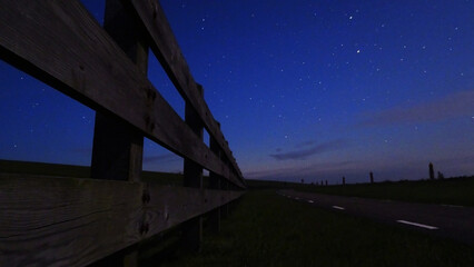 Fototapeta premium fence at night with stars