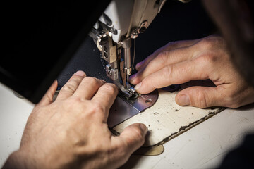 Tailoring of leather products. Repair of the car seat cover.