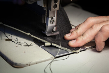 Tailoring of leather products. Repair of the car seat cover.