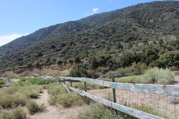 Fototapeta na wymiar old fence and mountain