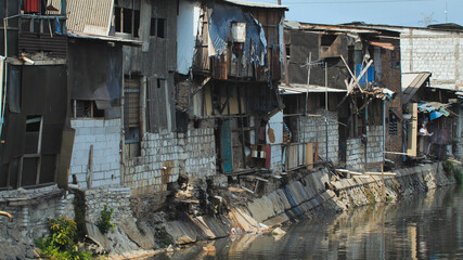 Slum area on the riverbank in Jakarta. Indonesia.