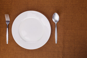 Empty white plate and kitchenware