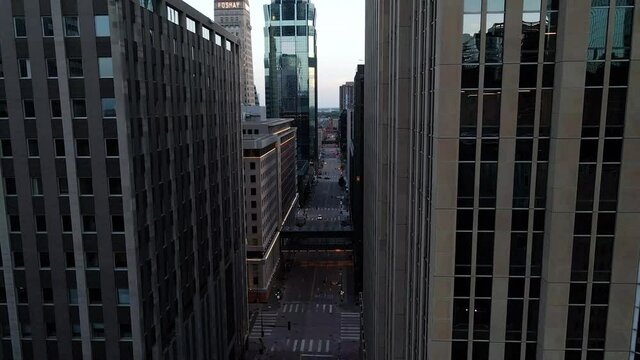 aerial view of downtown minneapolis, camera going between  tall buildings and showing the city features