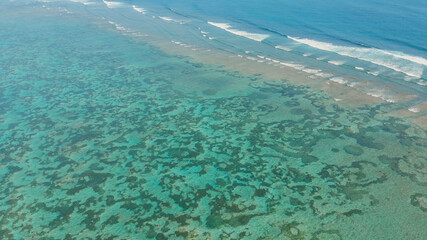 Fototapeta na wymiar Aerial view of the beautiful ocean floor with reefs near Pantai Pandawa. Indonesia.