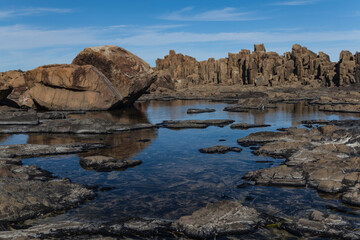 Fototapeta na wymiar Bombo Headland Quarry Australia. Blue skies and reflections in water