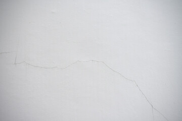 Cracked old white cement wall background