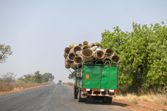 A truck fully loaded with sorrel baskets on a road in northern Benin.