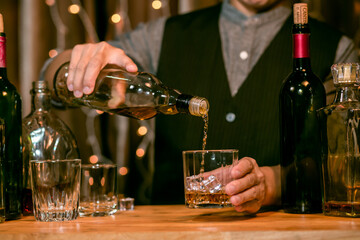 Whisky is poured into glass