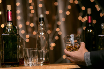 Barman pouring whiskey whiskey glass beautiful night