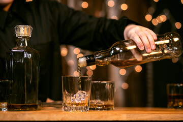 Barman pouring whiskey whiskey glass beautiful night