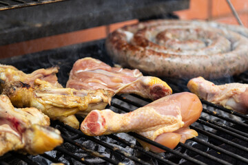 chicken and beef sausage, pork on a barbecue