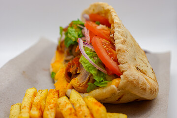 Greek Pitta Club Sandwich Pork / Lamb Melted Cheese Salad Tomatoes Lettuce Onions Fries Chips Seasoning