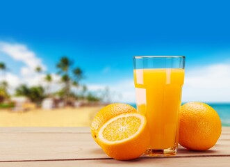 Orange juice in glass and slices of orange fruit
