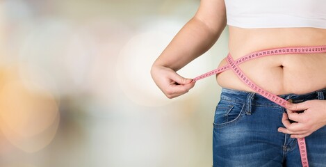 Obesity overweight woman with measuring tape