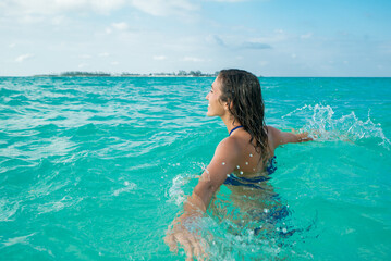 Woman Splashing in Tropical Water