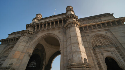 Fototapeta na wymiar Gate of India in Mumbai against a blue sky.