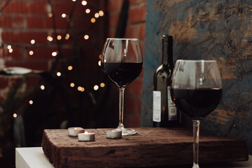  Red wine in two glasses, a romantic date on the balcony