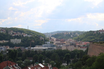 Fototapeta na wymiar Aerial panorama of Prague on a hot, cloudy summer day