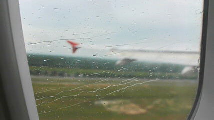Take off the plane in bad rainy weather.