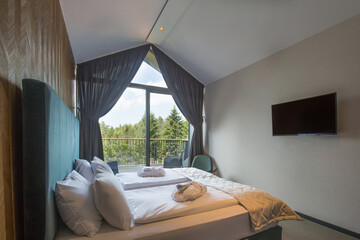 Fototapeta premium Interior of a luxury hotel bedroom in mountain hotel resort