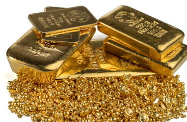 A pile of gold bars and gold granules isolated on white background. Selective focus.