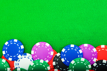 poker chips close up money on a green baize table with copy space