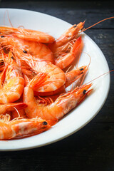 shrimp cooked seafood ready to eat prawn Menu concept serving size. food background top view copy space for text organic healthy eating raw