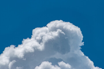 Naklejka na ściany i meble Clouds in blue sky background with copy space