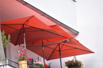 red umbrellas in the balcony