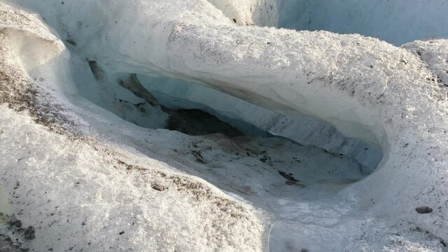 Glacier sinkhole or moulin formed on Iceland's vatnajokull following unusually warm Summer.