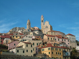 Obraz premium Cervo Ligure, Italy - 06/15/2020: Travelling around the Riviera Ligure in summer days. Beautiful photography of the small vilagges near the sea with typical old buildings.