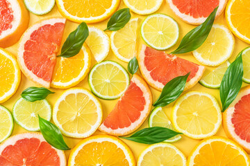 Sliced grapefruit, orange, lemon and lime. The concept of citrus fruits, vegetarianism, healthy fruits. Bright background image.