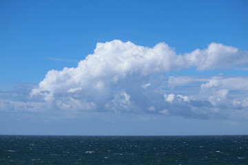 Ocean view with clean horizon and dramatic cloud formation