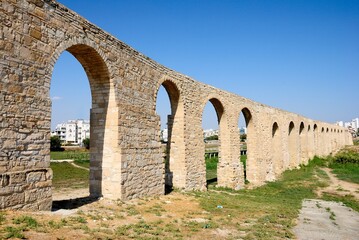 Fototapeta na wymiar Ancient Kamares Aqueduct, also known as the Bekir Pasha Aqueduct near Larnaca, Cyprus