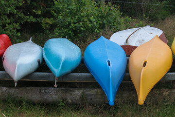 canoes turned over and stored by the sea