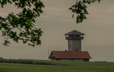 Sunset in hot summer rainy evening with observation tower