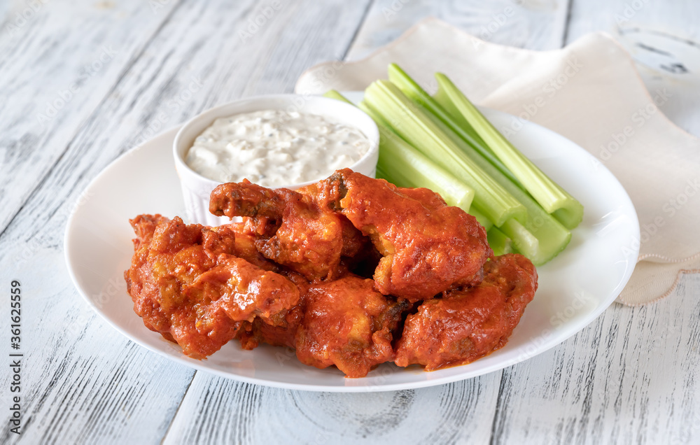 Wall mural bowl of buffalo wings with blue cheese dip