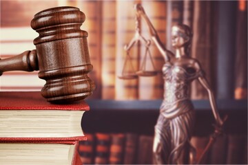 Statue of justice on library background.
