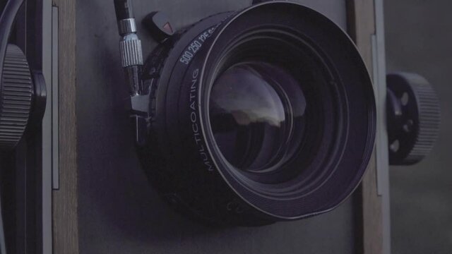 Close up shot of large format camera lens in the Scottish highlands.