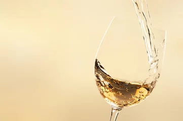 Rolgordijnen White wine being poured in wineglass © BillionPhotos.com