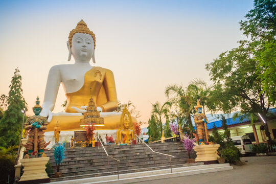Beautiful big buddha image at Wat Phra That Doi Kham. Chiang Mai, Thailand. Wat Phra That Doi Kham (Wat Doi Kham or the Golden temple) is located at the top of a hill to the south west of the city.