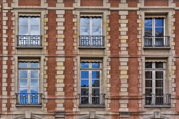 Obraz premium View of Unique traditional French windows and balconies. Paris, France.