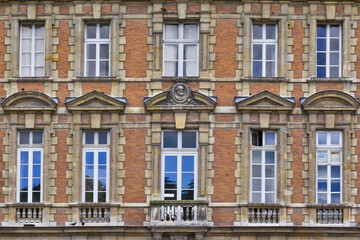 Fototapeta na wymiar View of Unique traditional French windows and balconies. Paris, France.
