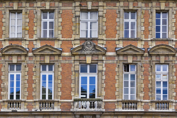 Fototapeta premium View of Unique traditional French windows and balconies. Paris, France.